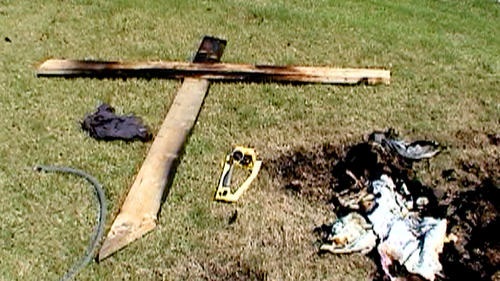 A 10–foot–tall cross was set ablaze in the front yard of an Anaheim Hills home. African Americans were the target of 11 hate crimes in Orange County last year, according to the Orange County Human Relations Commission. (Greg Harris)